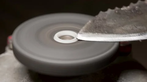 Sharpening an old metal knife Stock Footage 169835397