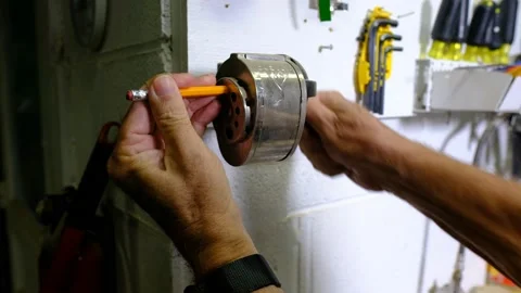 Sharpening a pencil in an old fashioned manual pencil sharpener Stock Footage 139006234