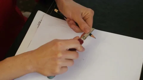 Sharpening the pencil is ready to use with a cutter knife on a white background. 스톡 동영상 152519625