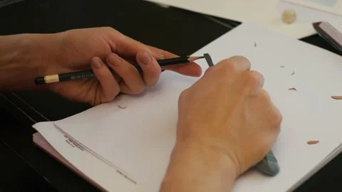 Sharpening the pencil is ready to use with a cutter knife on a white background. 動画素材 152519640