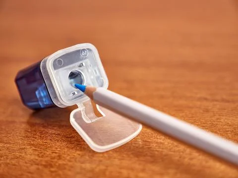Sharpening pencils. Sharpener with container and pencil. Stock Photos