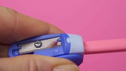 Sharpening pink drawing pencil Stock Footage 83144412
