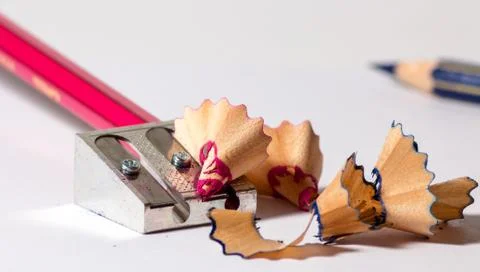 Sharpening a red pencil Stock Photos
