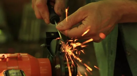 Sharpening side screwdriver on electrical grinding wheel Stock-Footage 65152995