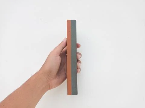 Sharpening stone held in hand 스톡 사진