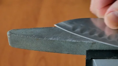 Sharpening sushi chef knife on grind stone 库存影片 103085632