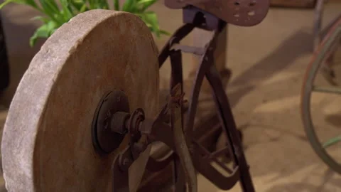 Sharpening wheel with metal seat in rustic setting Stock Footage 312072830