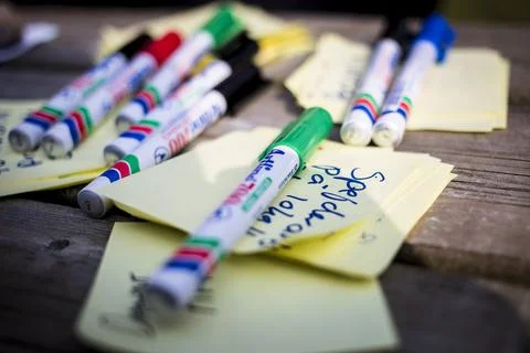 Sharpies and post-it notes on a table Stock Photos