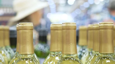 In sharpness alcohol bottles. Blur background of the department of alcohol in a Stock Footage 116060397