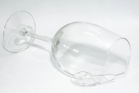 Shattered broken wineglass with sharp splinters Stock Photos