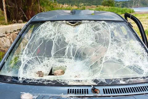 Shattered Car Windshield with Multiple Impact Points and Crushed Roof Stock Photos
