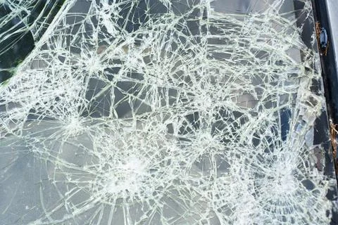 Shattered Car Windshield with Multiple Impact Points and Cracks Stock Photos