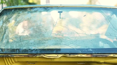 Shattered car windshield showing spiderweb pattern of damage from an accident Stock Footage 340508960