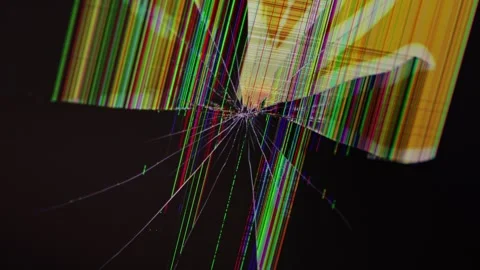 A shattered computer screen displays colorful glitches and pixel lines from.. Stock Footage 324964542