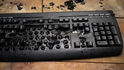 Shattered desktop keyboard. The losing computer player broke the keyboard. Stock Footage 136849969