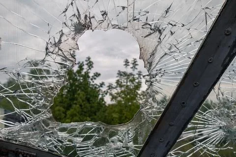 Shattered Glass, Green Trees Through Broken Window Stock Photos