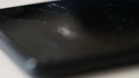 Shattered phone screen off rack focus Stock Footage 228691262