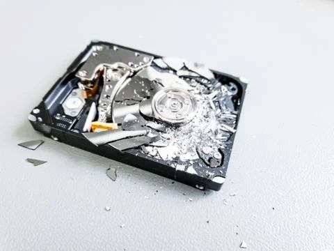 Shattered platter of computer hard drive disk. Stock Photos