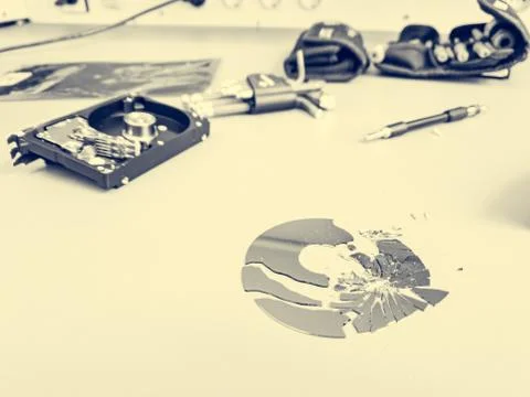 Shattered platter of computer hard drive disk. Stock Photos