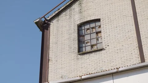 Shattered window on an old building Stock Footage 240180058
