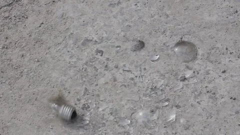 Shattering compact ordinary light bulb, slow motion. Stock Footage 252128499