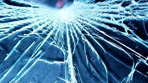 Shattering glass screen with a hammer. Breaking and cracking screen on grunge 動画素材 118670929
