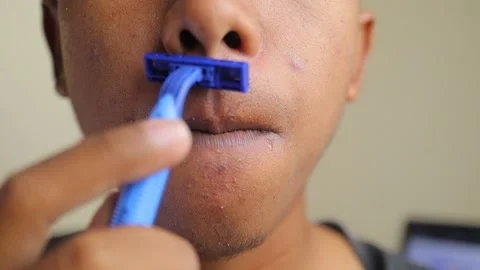 Shave the mustache on the face with a razor Stock-Footage 142506006