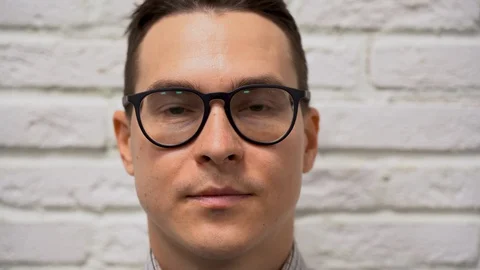 Shaved guy puts on, wear a protective mask during quarantine by reason of virus Stock Footage 127782846