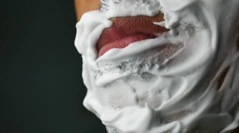 Shaving the beard with a razor. Young man shaving his beard in the morning with 스톡 동영상 55739136