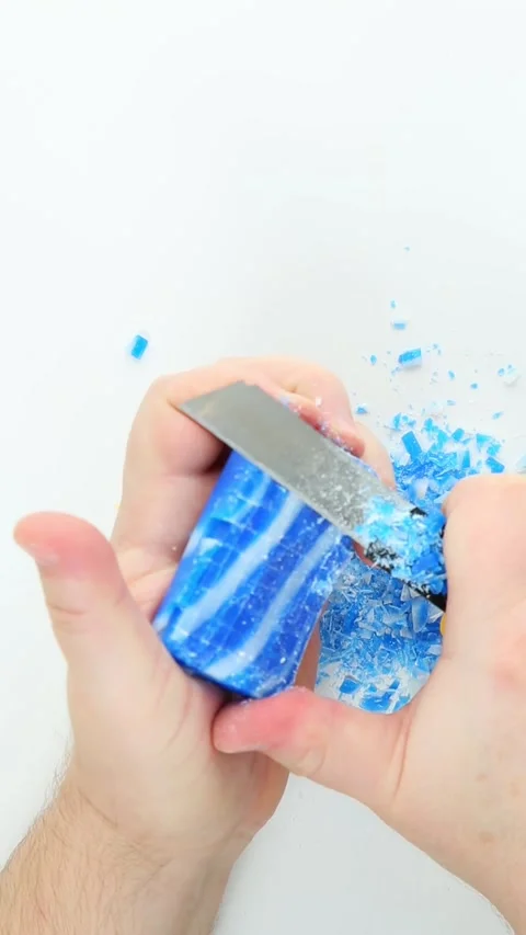 Shaving blue marbled soap bar with metal blade ASMR closeup Stock Footage 336265422