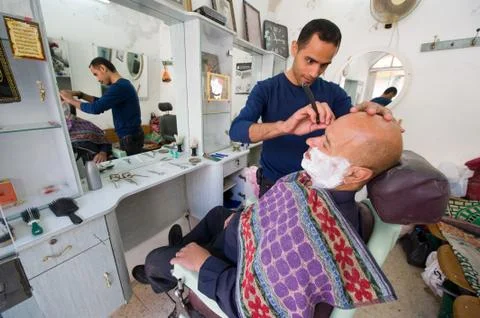 Shaving a client Stock Photos