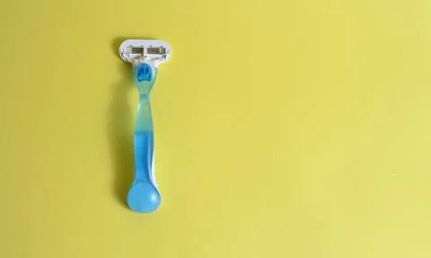 Shaving machine on a yellow background. Stock Photos