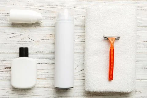 Shaving man set. shaving machine, towel, lotion and shaving foam on colored.. Stock Photos