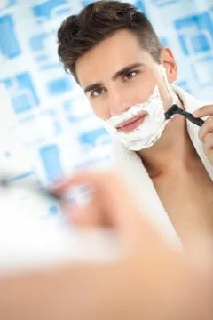 Shaving, morning routine. Stock Photos