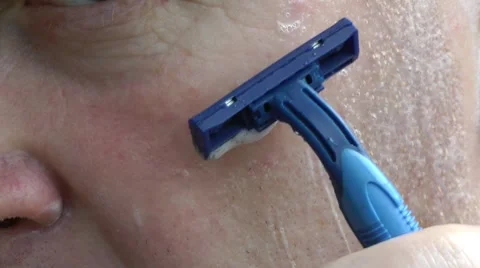 Shaving of the person by the razor Видео 8561609