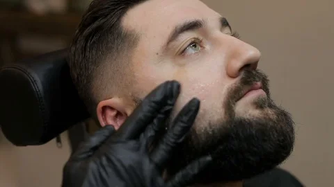 Shaving process of beard in barbershop Stock Footage 85175265