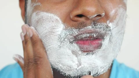 Shaving routine demonstration for a clean look at home Stock Footage 303614704