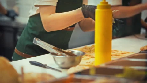 Shawarma cook prepares tasty appetizer in fast food kitchen during busy lunc Stock Footage 331357737