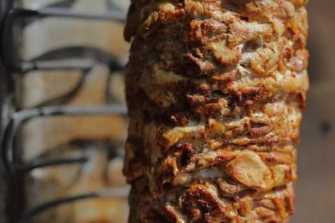 Shawarma meat being cut Фото