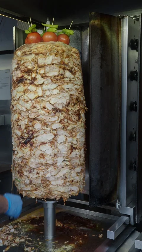 Shawarma meat on a spit Stock Footage 321577756