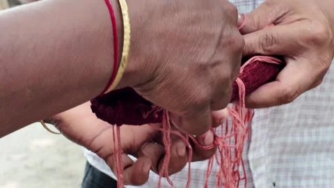 Shawl made with red tie-dye resist dyeing technique, Goalpara, Bangladesh Stock Footage 311337626