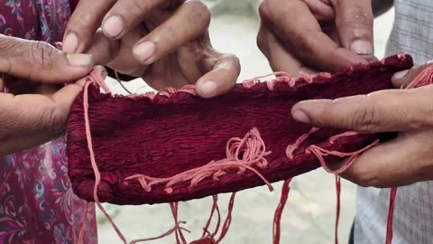 Shawl made with red tie-dye resist dyeing technique, Goalpara, Bangladesh Stock Footage 311337631