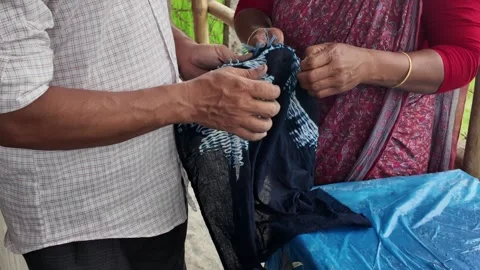 Shawl made with tie-dye resist dyeing technique, Goalpara, Bangladesh Stock Footage 311337668
