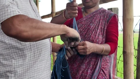 Shawl made with tie-dye resist dyeing technique, Goalpara, Bangladesh Stock Footage 311337676