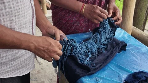 Shawl made with tie-dye resist dyeing technique, Goalpara, Bangladesh Stock Footage 311337685