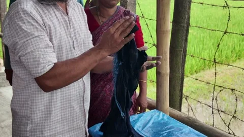 Shawl made with tie-dye resist dyeing technique, Goalpara, Bangladesh Stock Footage 311337688