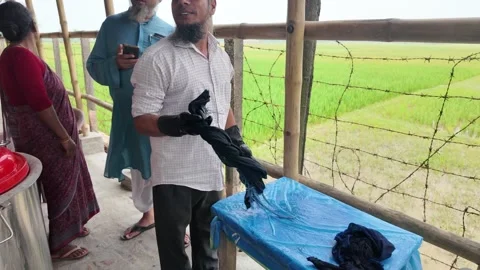 Shawl made with tie-dye resist dyeing technique, Goalpara, Bangladesh Stock Footage 311337694