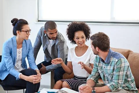 She always brings a new angle to every meeting. a diverse group of young Stock Photos