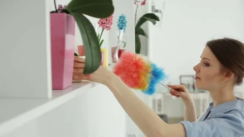She cleans the dust in the hotel Stock Footage 82155892