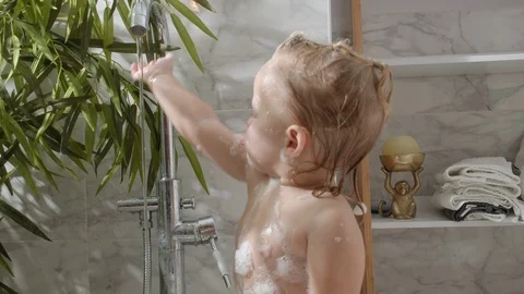 She does not like the foam on face Stock Footage 124623373